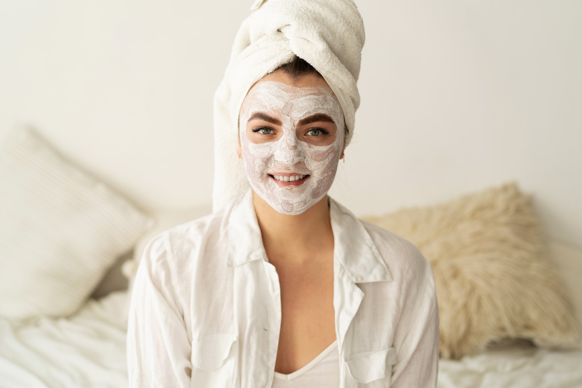 beautiful-woman-applying-facial-mask.jpg