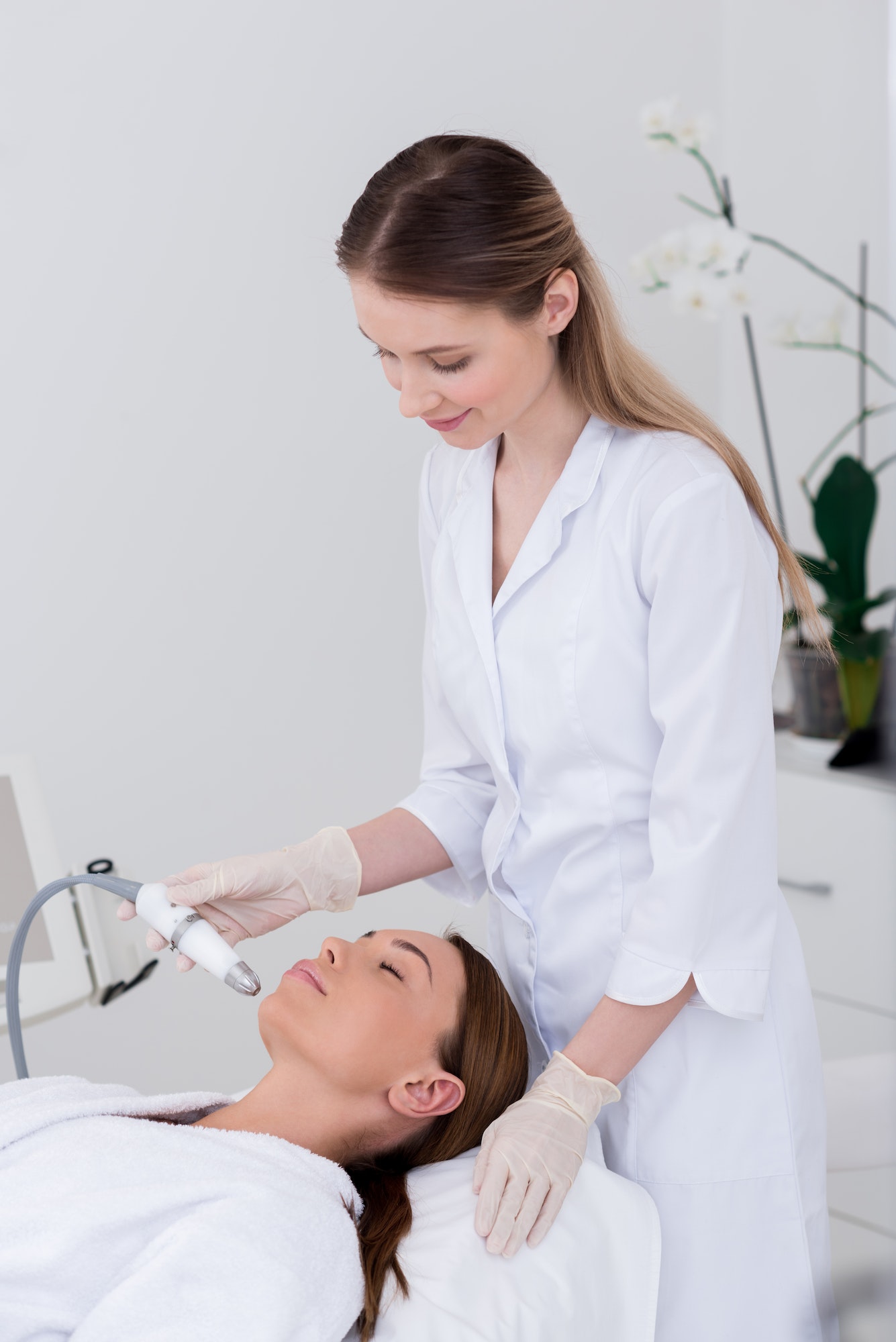 young-woman-getting-facial-treatment-in-cosmetology-salon.jpg